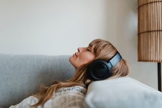 women listens with headphones