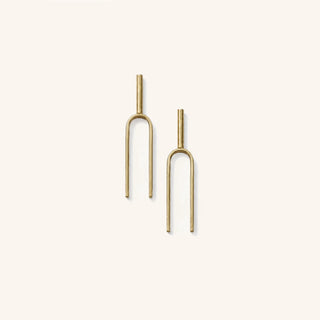 Small Handmade Tuning Fork Earrings in solid brass on a neutral background