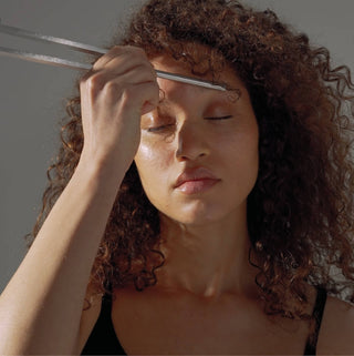woman using a sonic slider for sound therapy